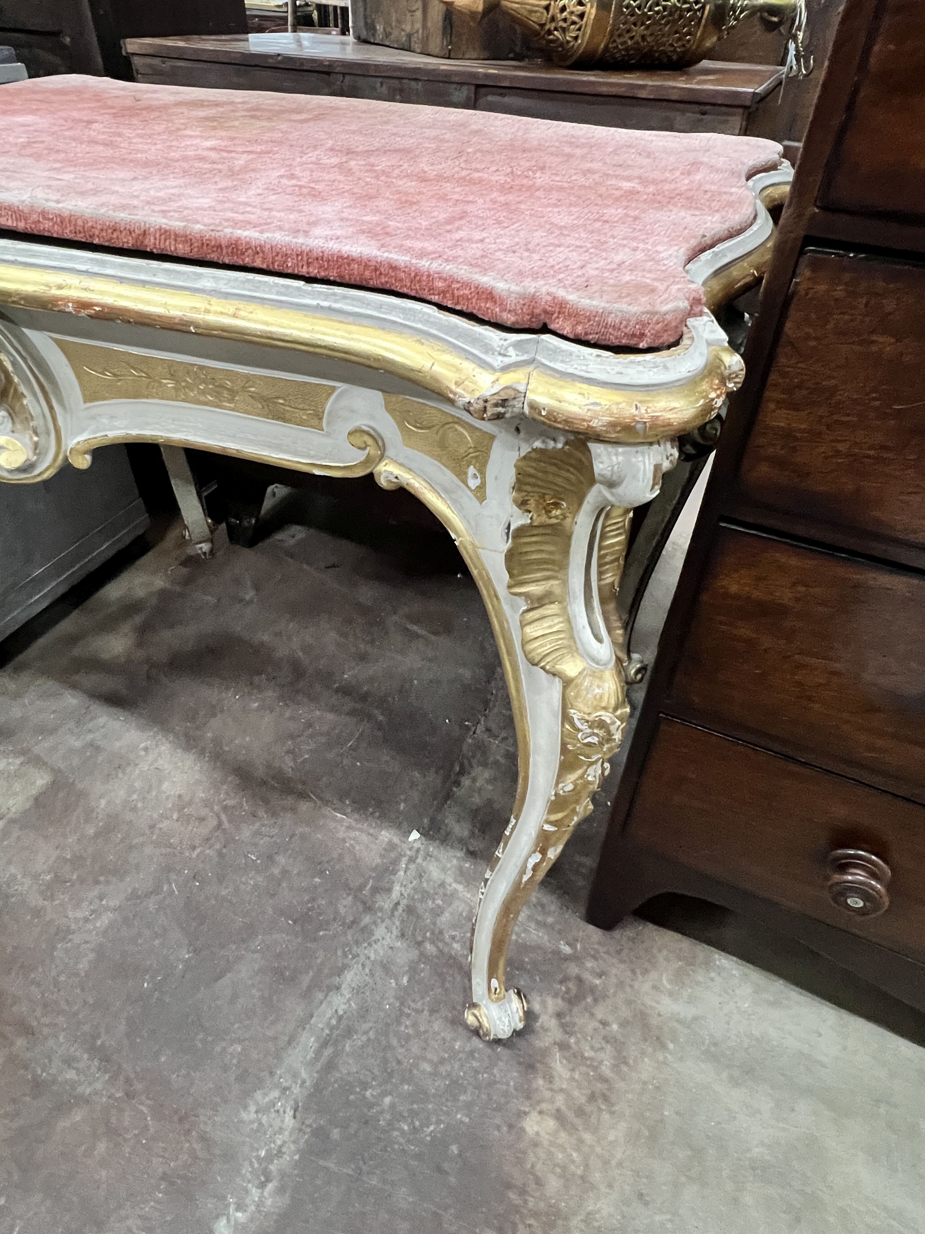 An Italian painted parcel gilt centre table, width 105cm, depth 68cm, height 86cm